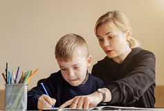 A mother teaching her son with autism