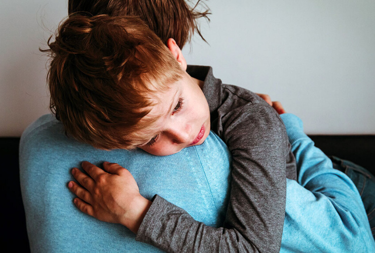 A parent calming his autistic child