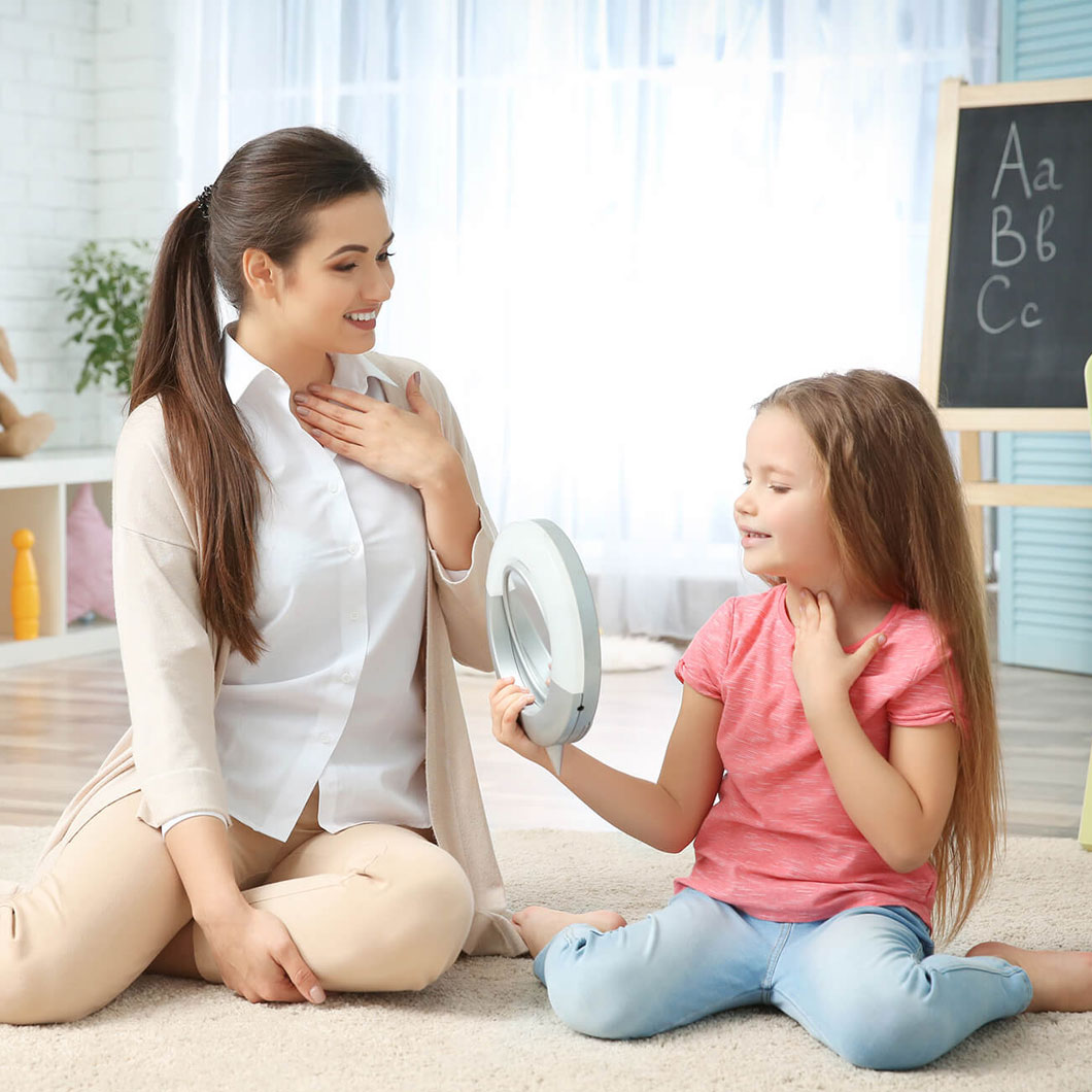 A therapist giving home-based ABA therapy to a girl with Autism